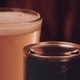 A flat-top beer can with distinctive triangular punchouts from a “churchkey” can opener.
